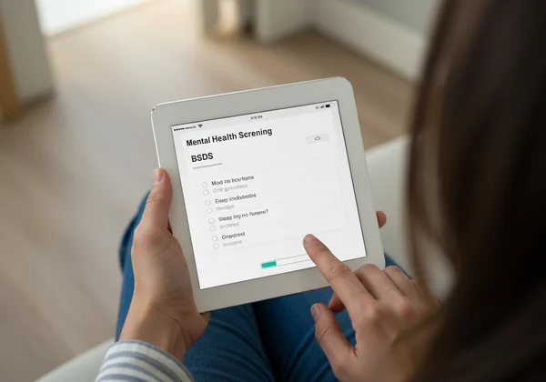 Person taking a mental health screening test online.